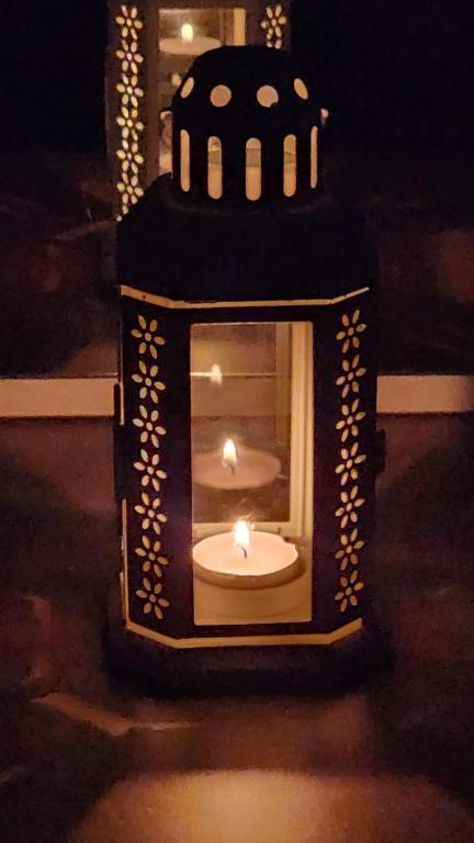 a small house with a candle in the middle at Haifa night's in Haifa