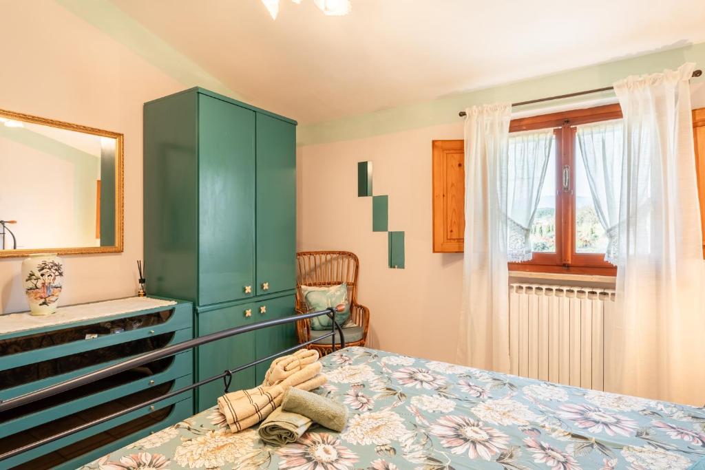 Postel nebo postele na pokoji v ubytování Casa di Nonna Tosca Montecarlo