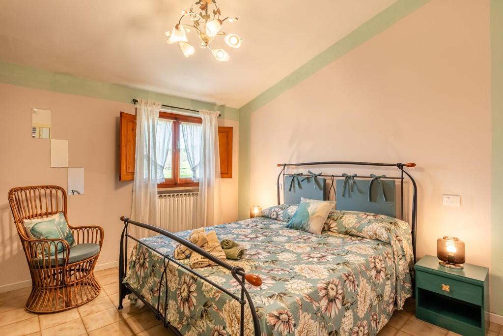 Postel nebo postele na pokoji v ubytování Casa di Nonna Tosca Montecarlo