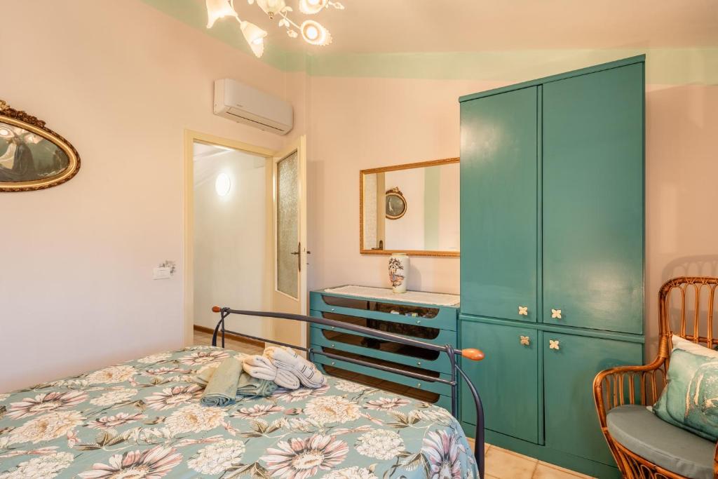 Postel nebo postele na pokoji v ubytování Casa di Nonna Tosca Montecarlo