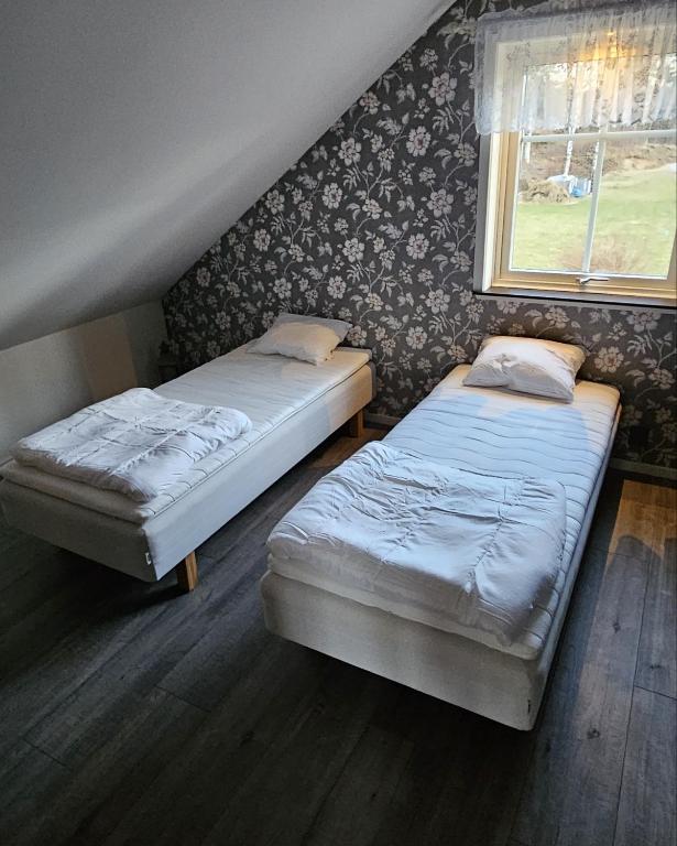 Postel nebo postele na pokoji v ubytování Guesthouse Erlandseröd