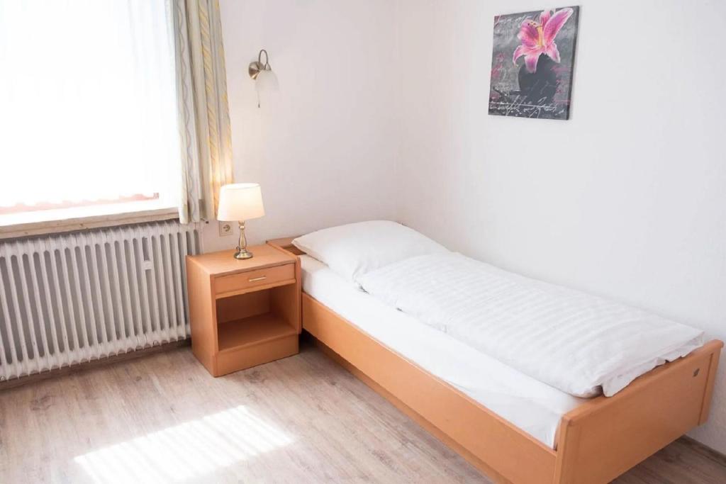 Postel nebo postele na pokoji v ubytování Pension Isernhagen