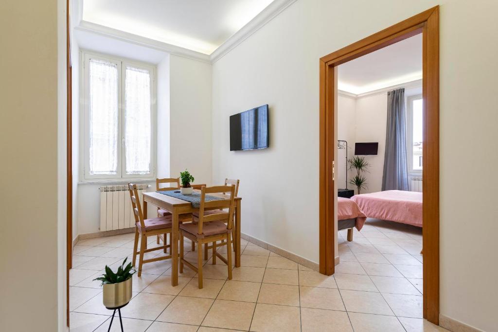 Posteľ alebo postele v izbe v ubytovaní Redseven Rome Apartments