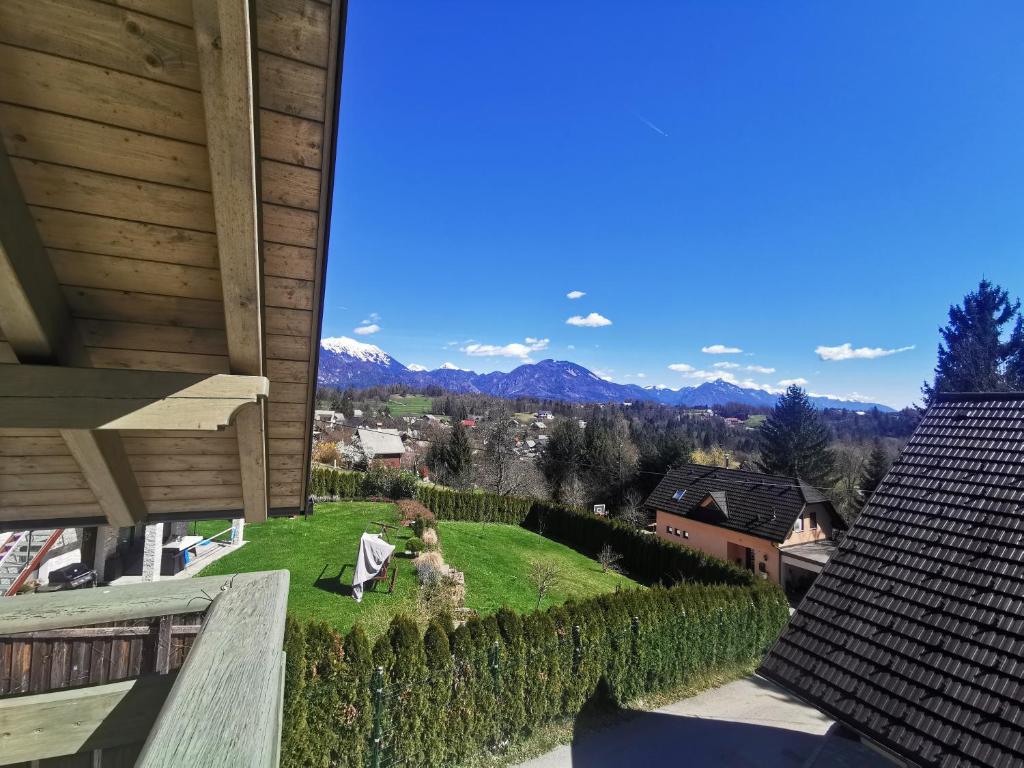 a view of the mountains from the balcony of a house at Forest House in Bled