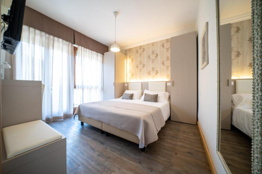 Postel nebo postele na pokoji v ubytování B City Hotel