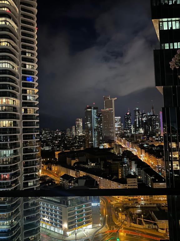 a view of a city skyline at night at Skyline Blick Frankfurt - Nahe Messe in Frankfurt