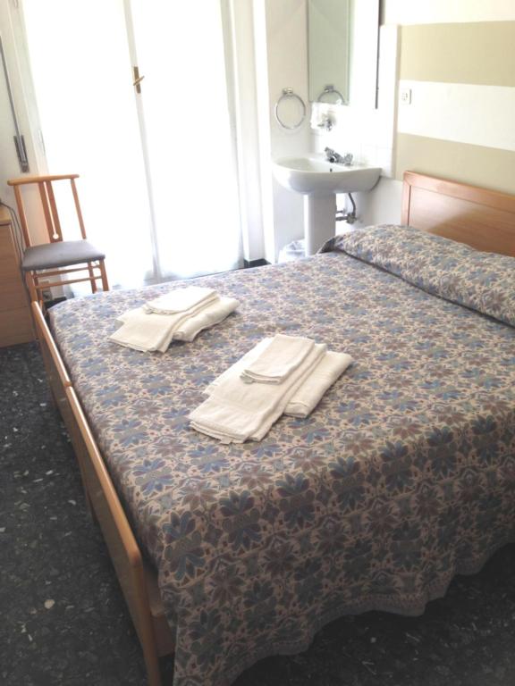 Postel nebo postele na pokoji v ubytování Albergo La Neigra