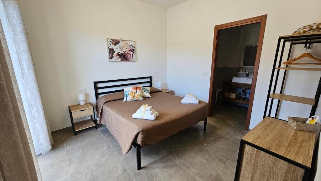 Postel nebo postele na pokoji v ubytování Il sogno di Gaggiuin