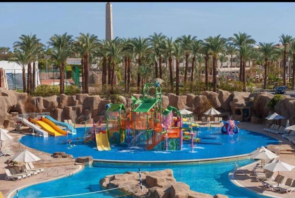 a pool at a resort with a water park at شرم الشيخ in Alexandria