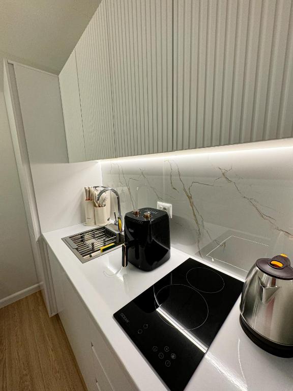 O bucătărie sau chicinetă la Nomad Stay Apartments