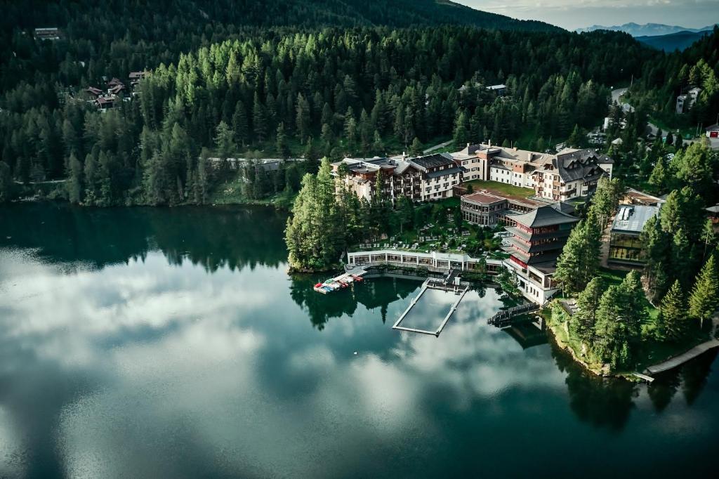 an aerial view of a resort on a lake at Hotel Hochschober in Turracher Hohe