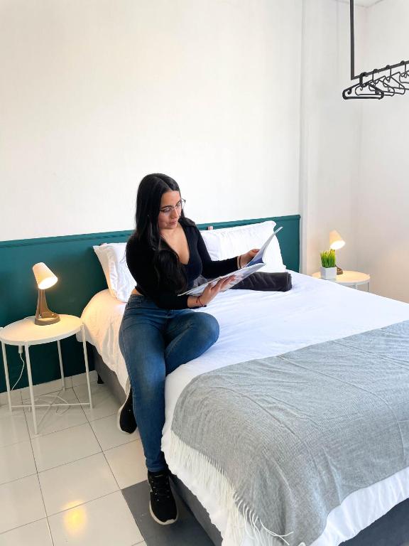 Postel nebo postele na pokoji v ubytování Nomadia Coliving Boutique