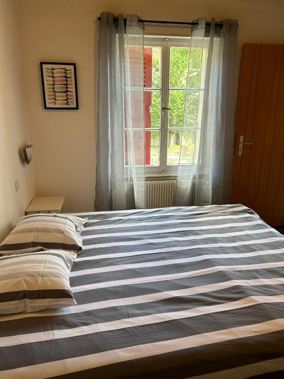Postel nebo postele na pokoji v ubytování Chambres d'Hôtes Le Felseneck