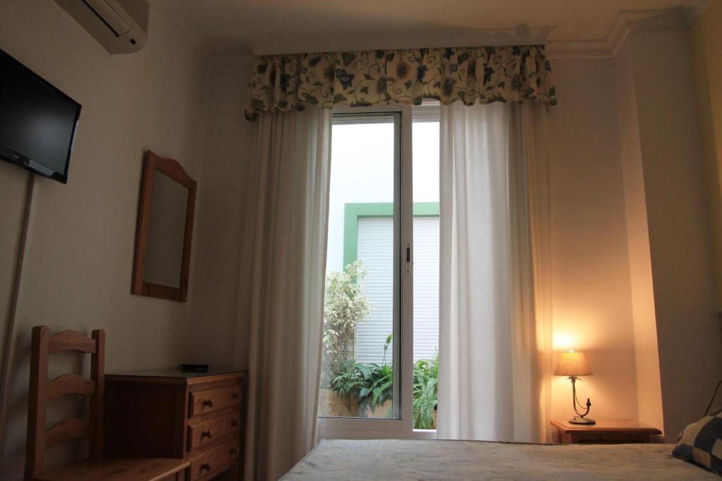 Postel nebo postele na pokoji v ubytování Hostal Ana - Adults Recommended