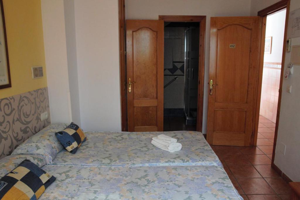 Postel nebo postele na pokoji v ubytování Hostal Ana - Adults Recommended