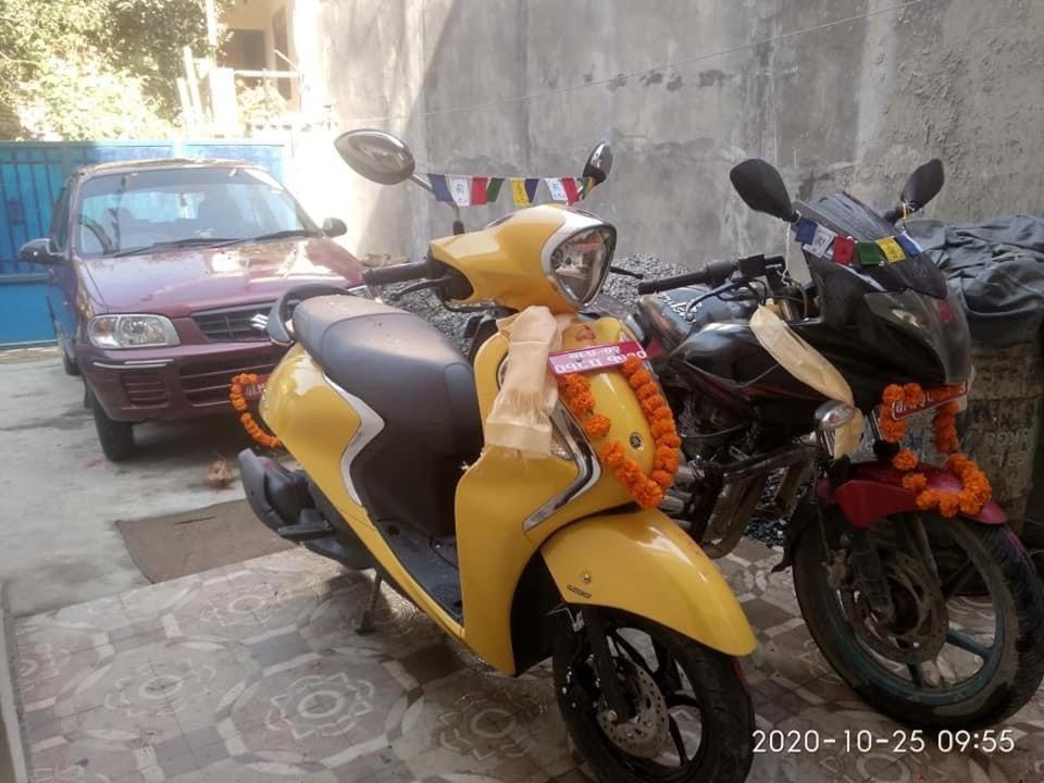 two motorcycles parked next to each other on a street at Sanumaya Guest house in Kathmandu