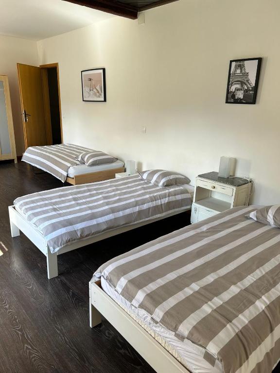 Postel nebo postele na pokoji v ubytování Chambres d'Hôtes Le Felseneck