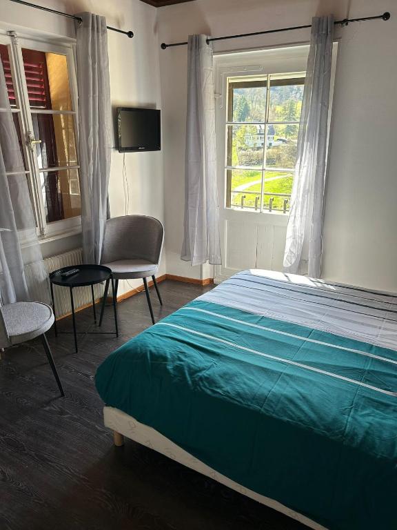 Postel nebo postele na pokoji v ubytování Chambres d'Hôtes Le Felseneck