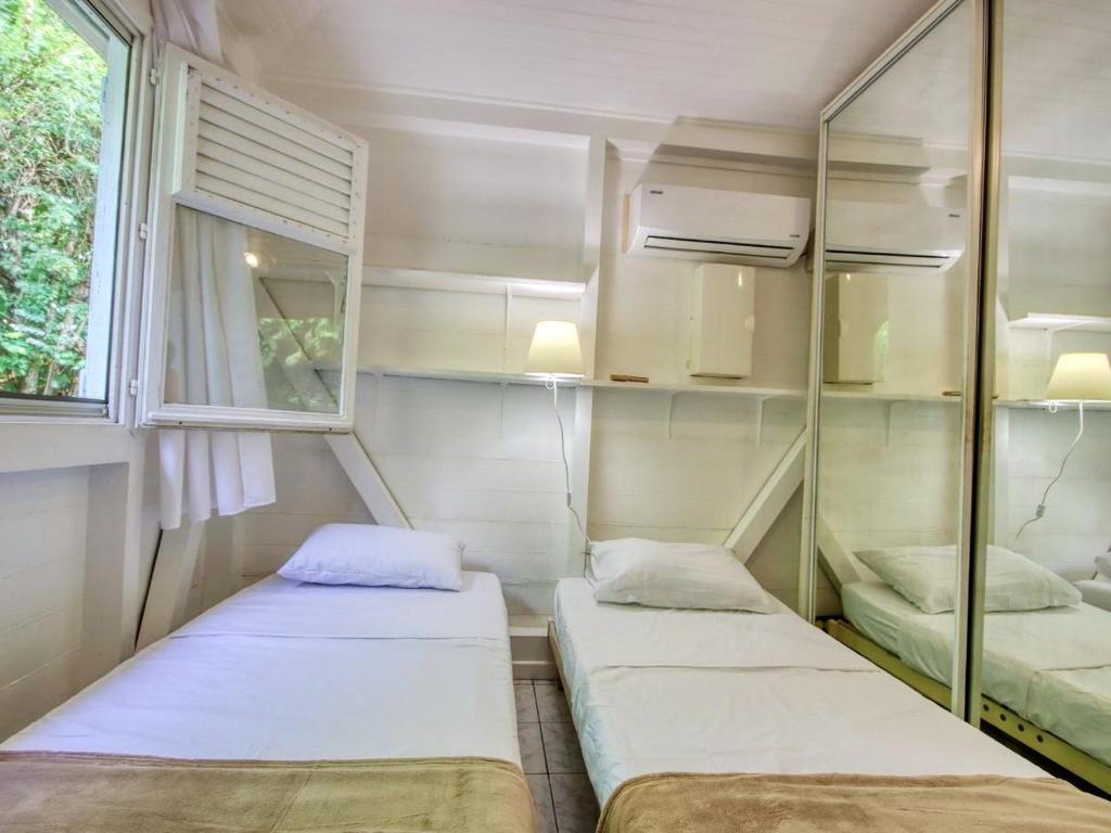 Postel nebo postele na pokoji v ubytování Villa en bord de mer à Saint-Pierre, 100 m²