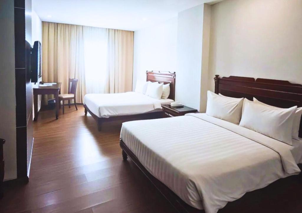 Postel nebo postele na pokoji v ubytování Penview Hotel
