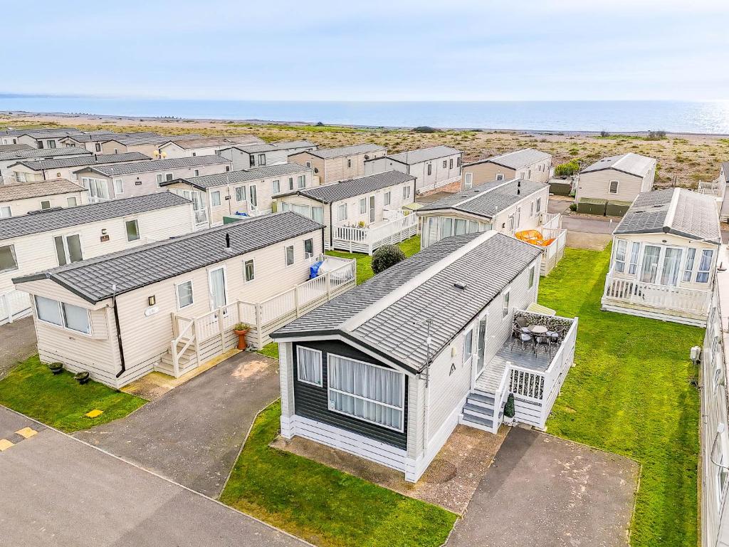 an aerial view of a row of houses at 30 Bayside Cove Pevensey Bay Holiday Park in Pevensey