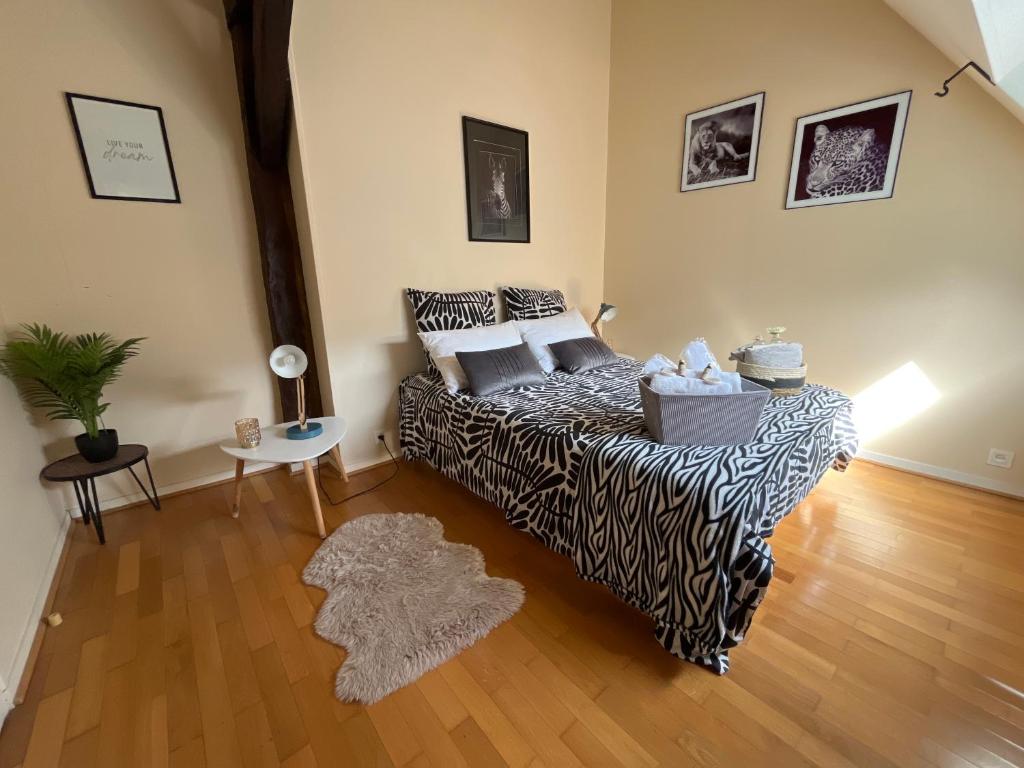 Ein Bett oder Betten in einem Zimmer der Unterkunft Les Gites d&#39;Albatre, le 44