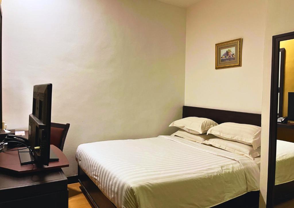 Postel nebo postele na pokoji v ubytování Penview Hotel