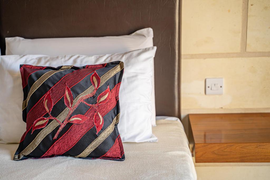 Postel nebo postele na pokoji v ubytování Il-Logga Boutique Hotel
