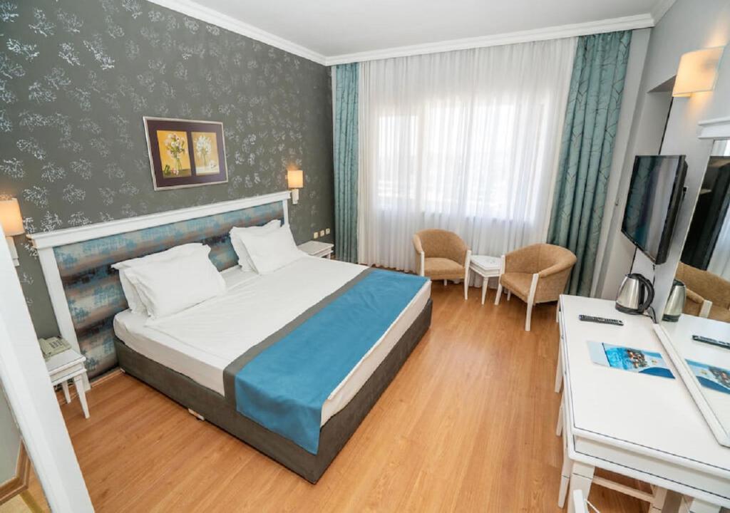 Postel nebo postele na pokoji v ubytování Armas Pemar Beach