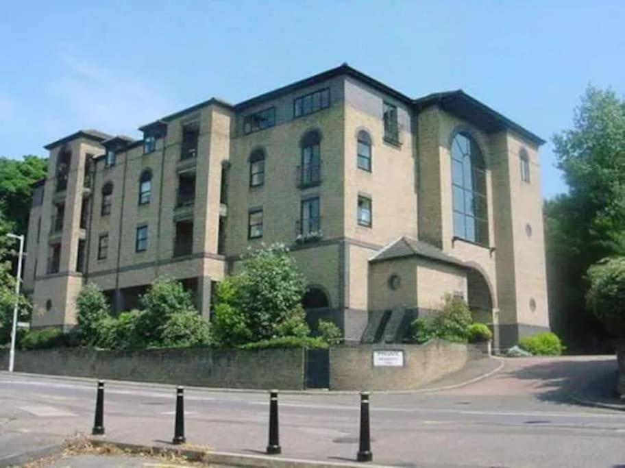 a large brick building on the corner of a street at Urban Oasis in Billericay