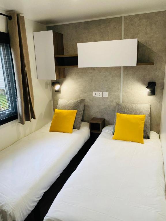 Posteľ alebo postele v izbe v ubytovaní Mobil home familial neuf de 2024 pour 8 personnes