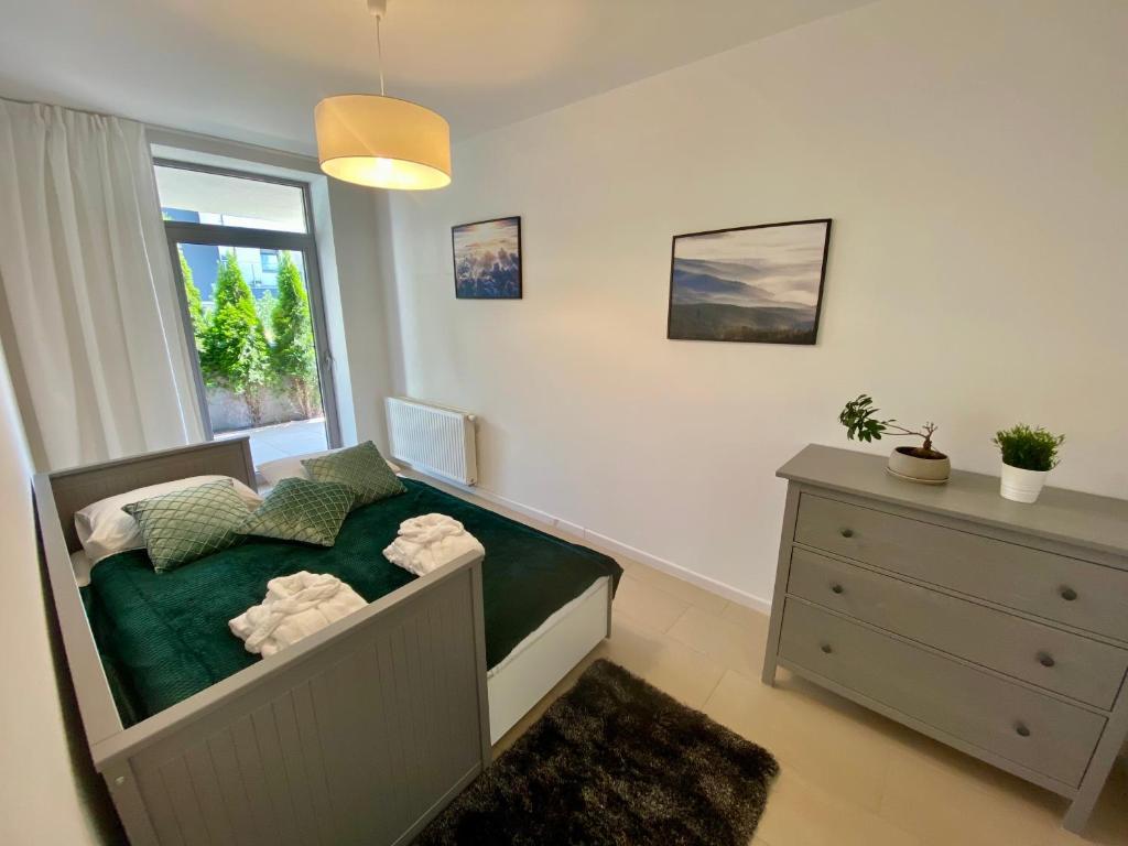 Postel nebo postele na pokoji v ubytování Apartview Bukowa II by Rent like home