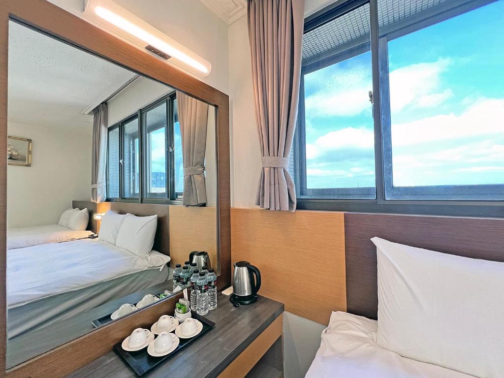 Postel nebo postele na pokoji v ubytování Foung Kou Hotel