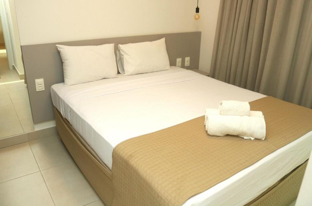 Postel nebo postele na pokoji v ubytování Edifício Promenade II Apt 306-Mandi Hospitalidade