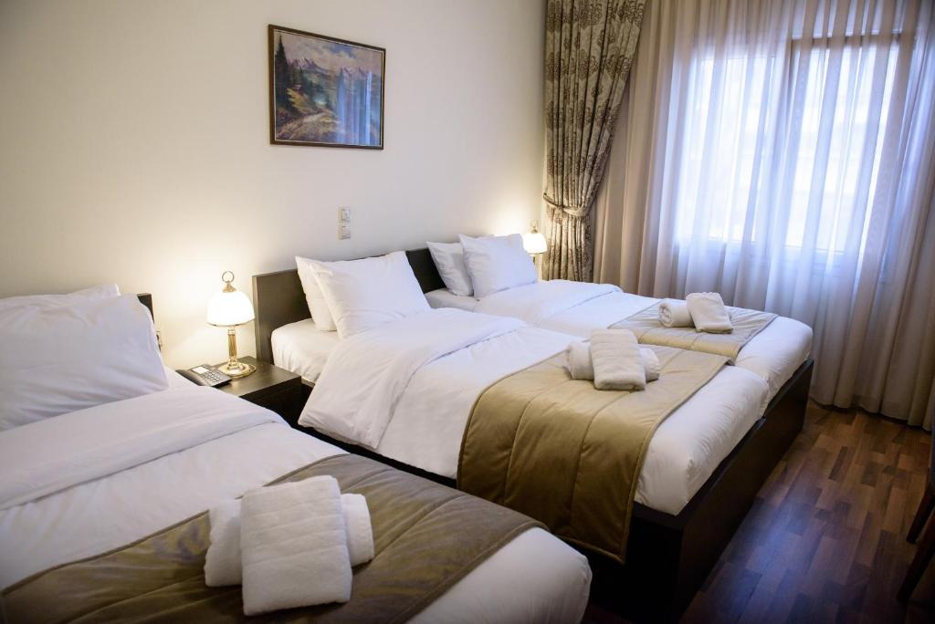 Postel nebo postele na pokoji v ubytování Hotel Padelidaki