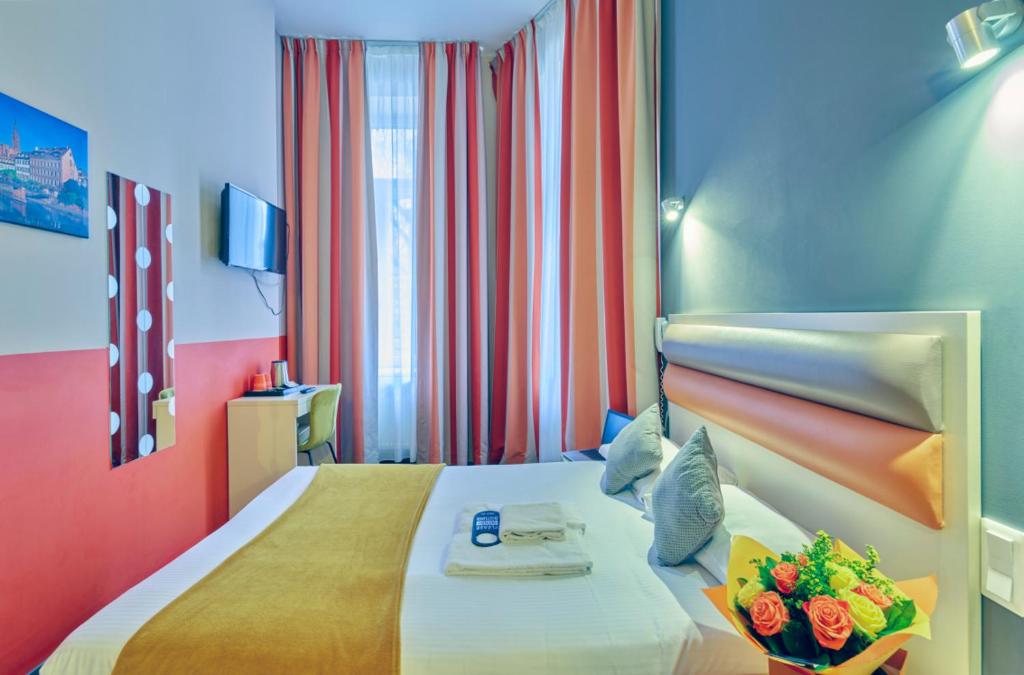 Postel nebo postele na pokoji v ubytování Adonis Hotel Strasbourg