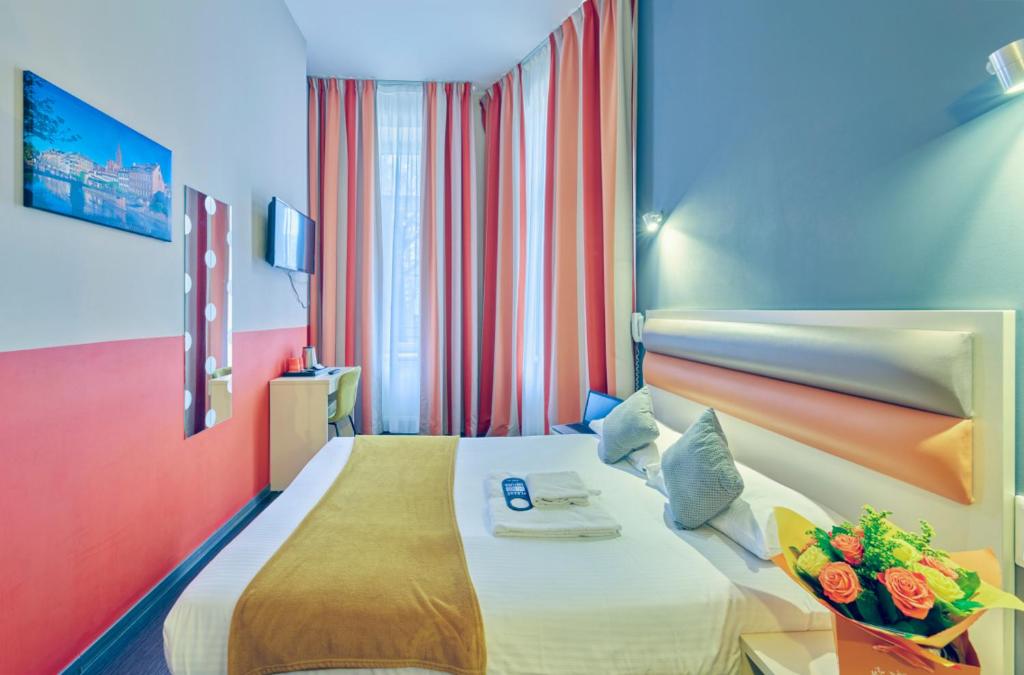 Postel nebo postele na pokoji v ubytování Adonis Hotel Strasbourg