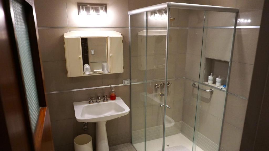 a bathroom with a shower and a sink at Hospedaje de Luz in San Salvador de Jujuy