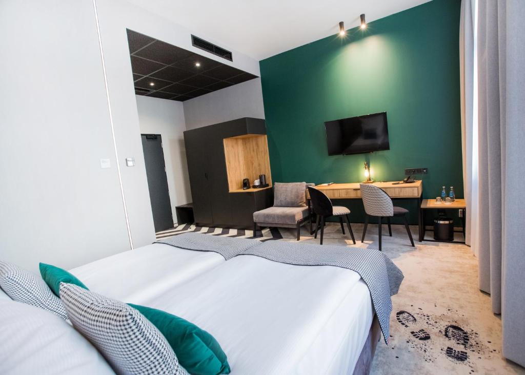 Postel nebo postele na pokoji v ubytování Hotel M23