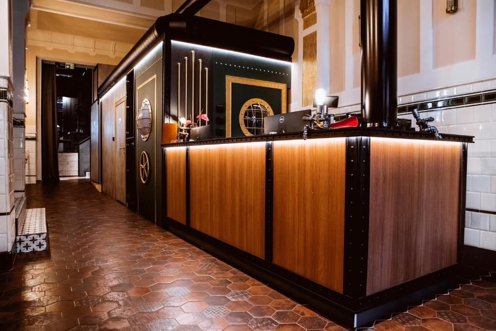 a bar in a room with a counter at Hotel M23 Katowice in Katowice