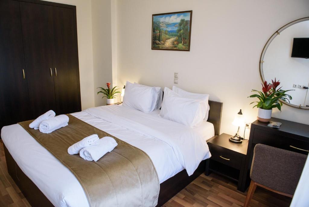 Postel nebo postele na pokoji v ubytování Hotel Padelidaki
