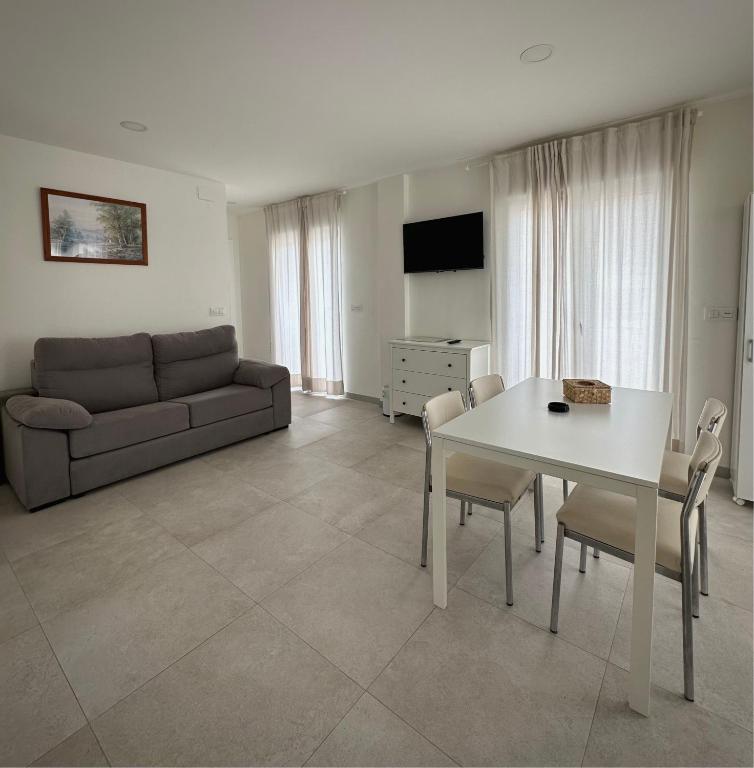 TV a/nebo společenská místnost v ubytování Apartamentos Turísticos Victoria