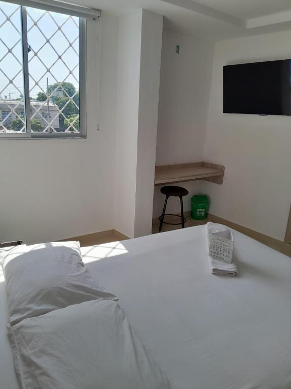 Postel nebo postele na pokoji v ubytování Hotel Nativo