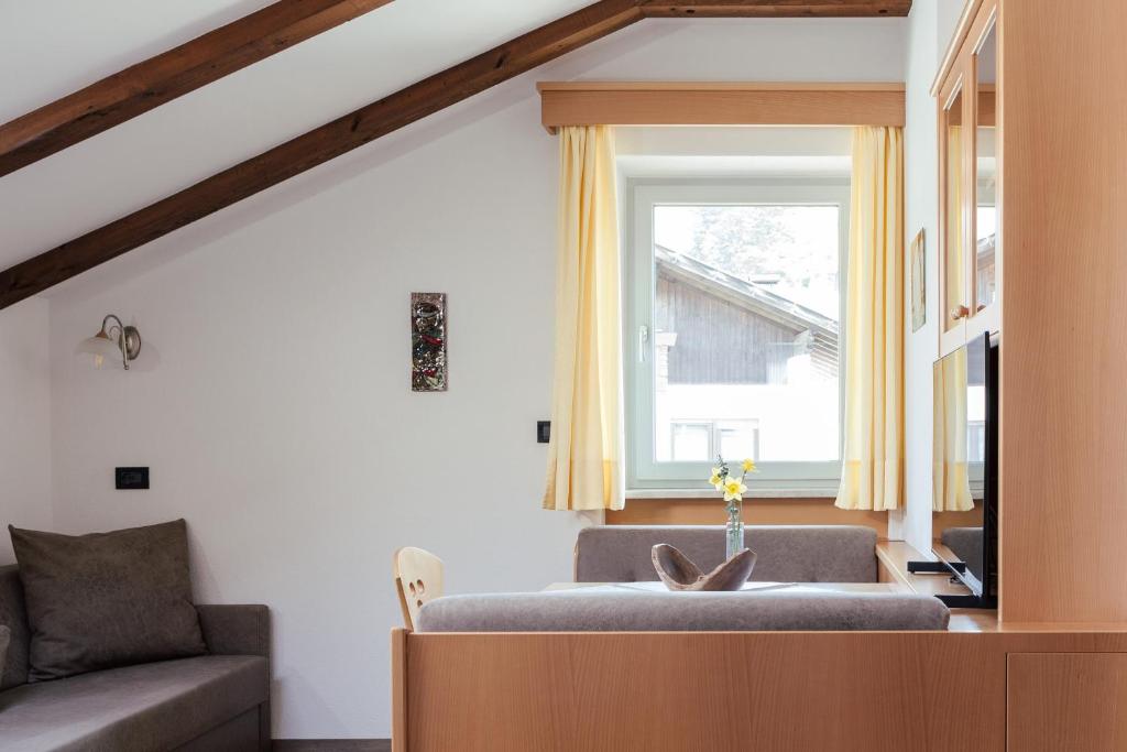 Posezení v ubytování Hotel Garni Sirmian