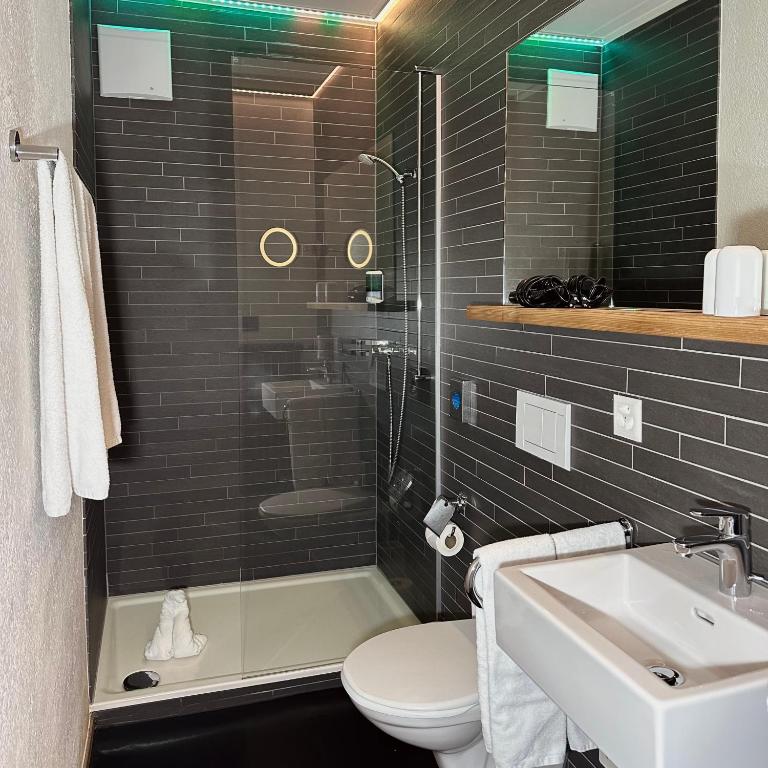 Koupelna v ubytování Hotel Rätia