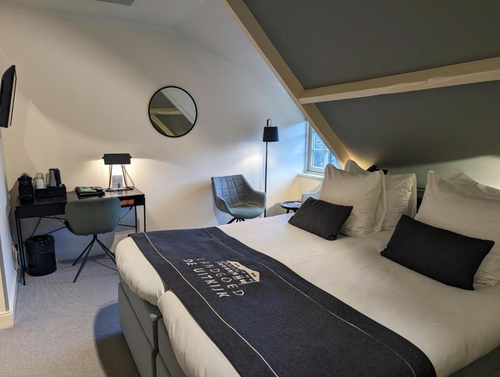 Een bed of bedden in een kamer bij Landgoed De Uitkijk Hellendoorn