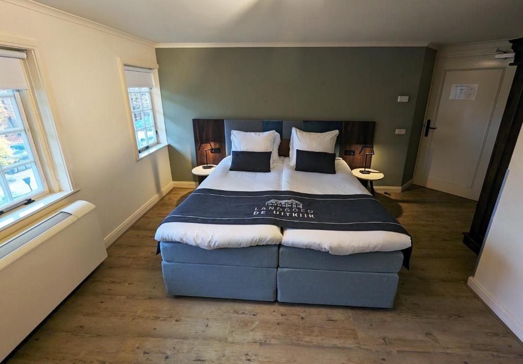 Een bed of bedden in een kamer bij Landgoed De Uitkijk Hellendoorn