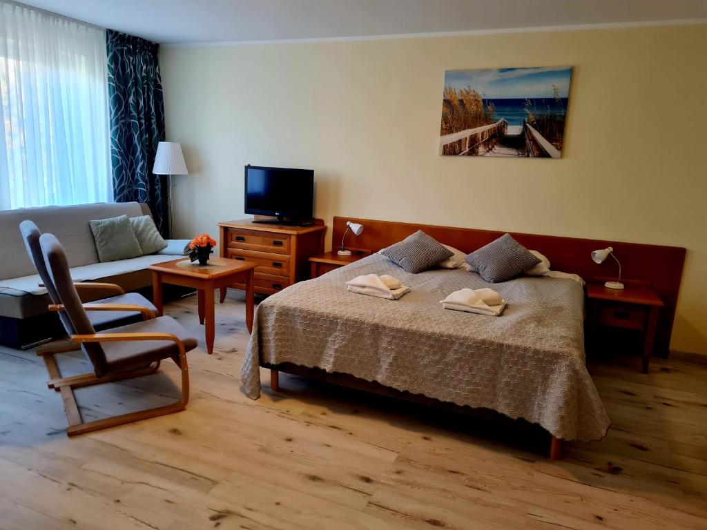 Posteľ alebo postele v izbe v ubytovaní ApartamentyPrzyMorzu Wschód Słońca Olymp z basenem