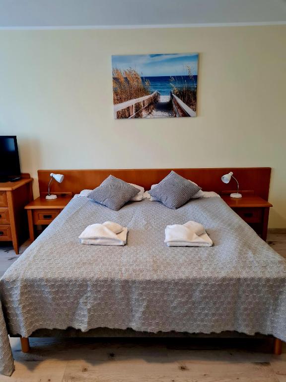 Posteľ alebo postele v izbe v ubytovaní ApartamentyPrzyMorzu Wschód Słońca Olymp z basenem