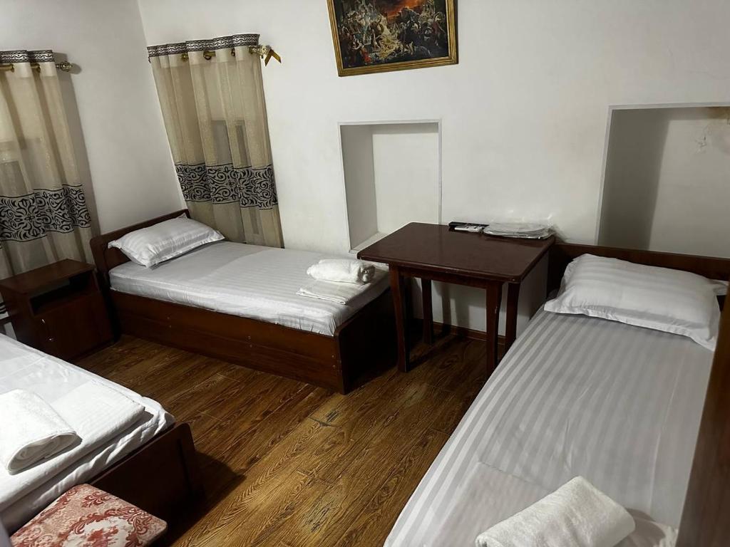 Een bed of bedden in een kamer bij OXUN Hotel
